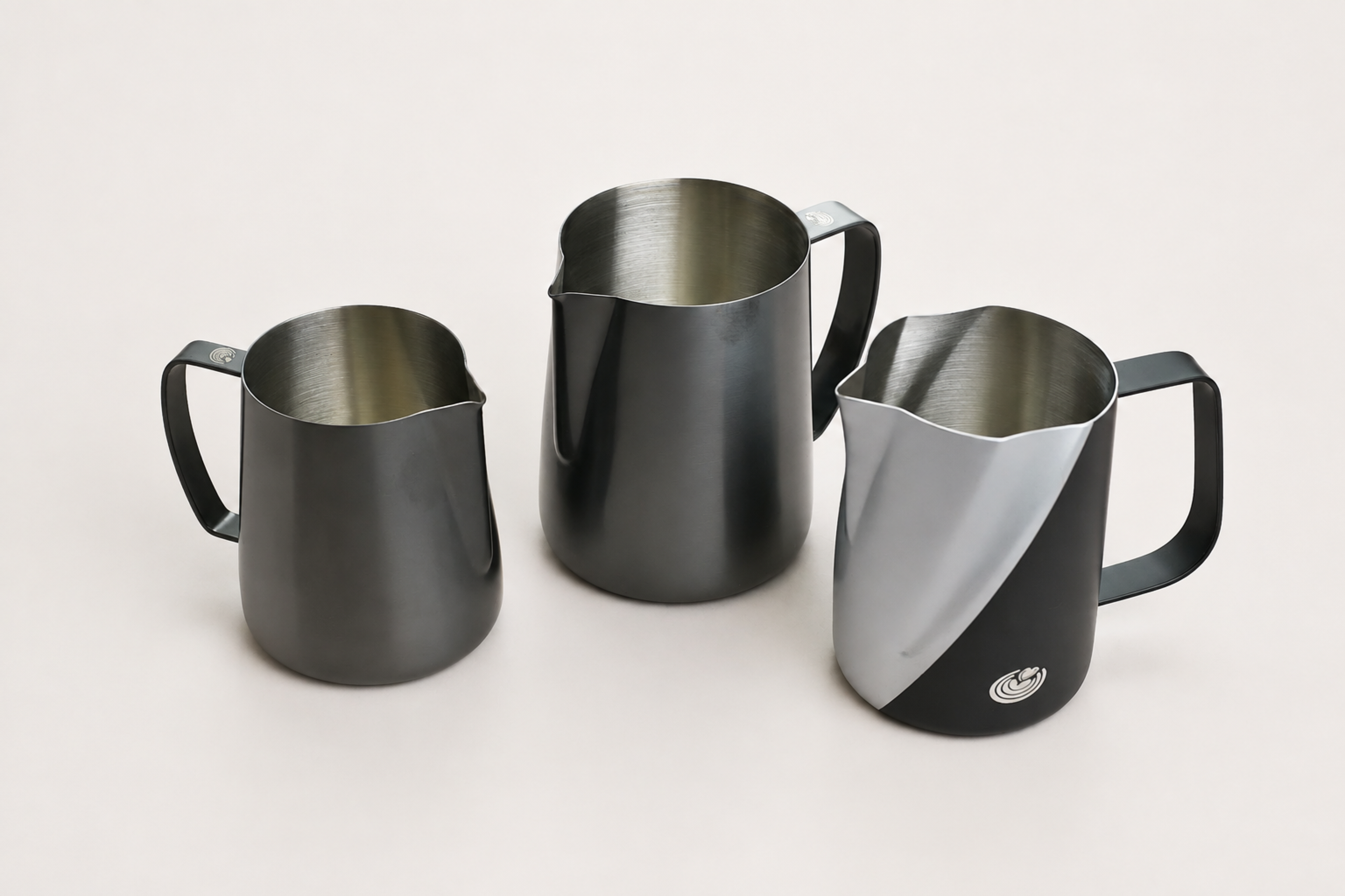 High-resolution Vortex and Ultra Sharp 2.0 three-pitcher set in Matte Black on a clean light ivory studio background