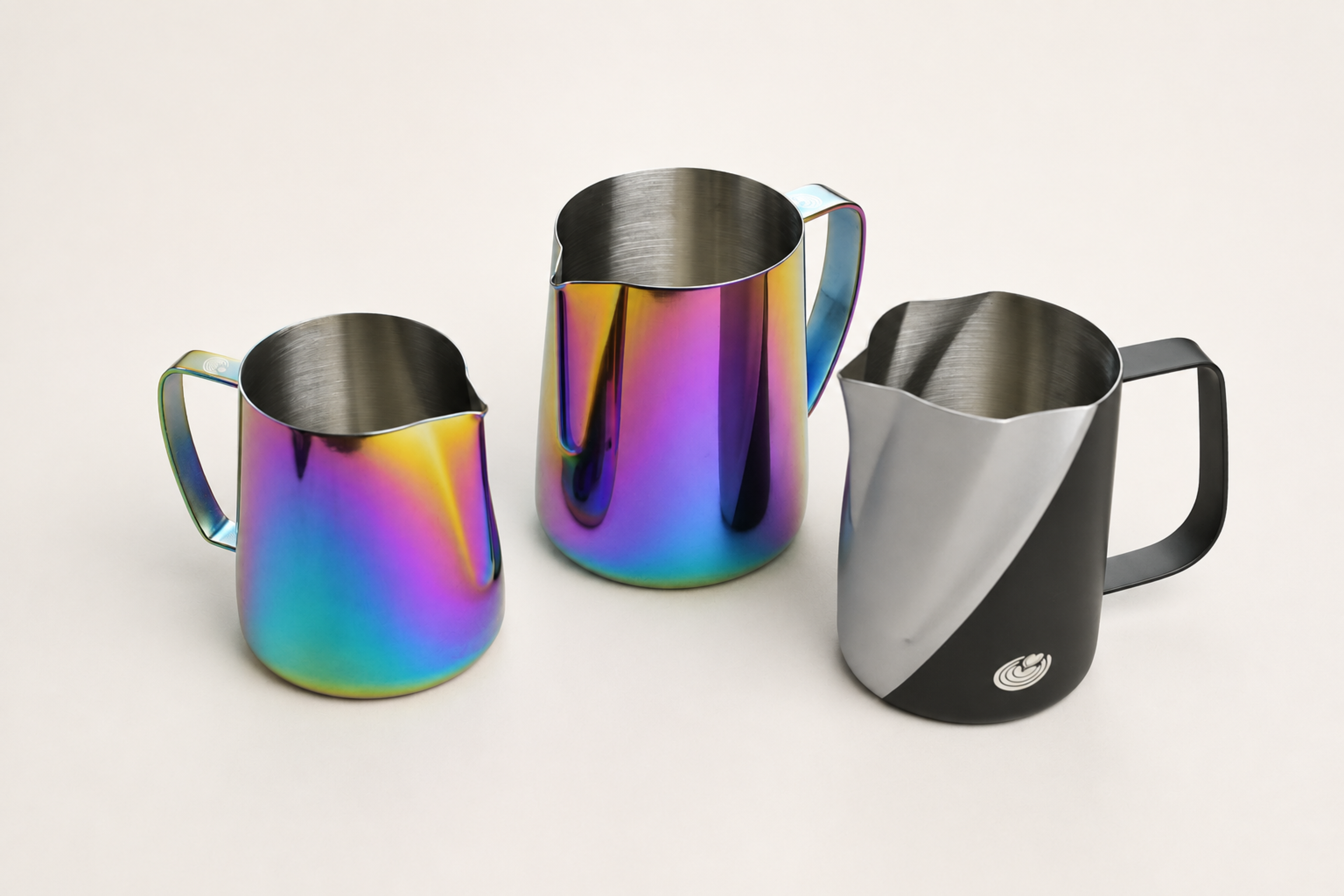 High-resolution Vortex and Ultra Sharp 2.0 three-pitcher set in Mirror Multicolor on a clean light ivory studio background